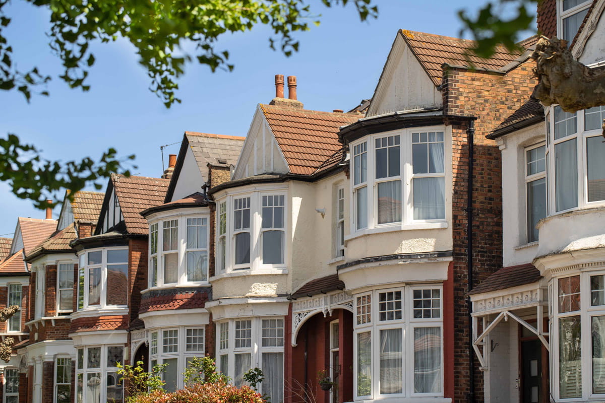 A row of Edwardian houses on a blue sky day