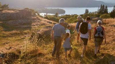 A family walking in the hills in the Lake District